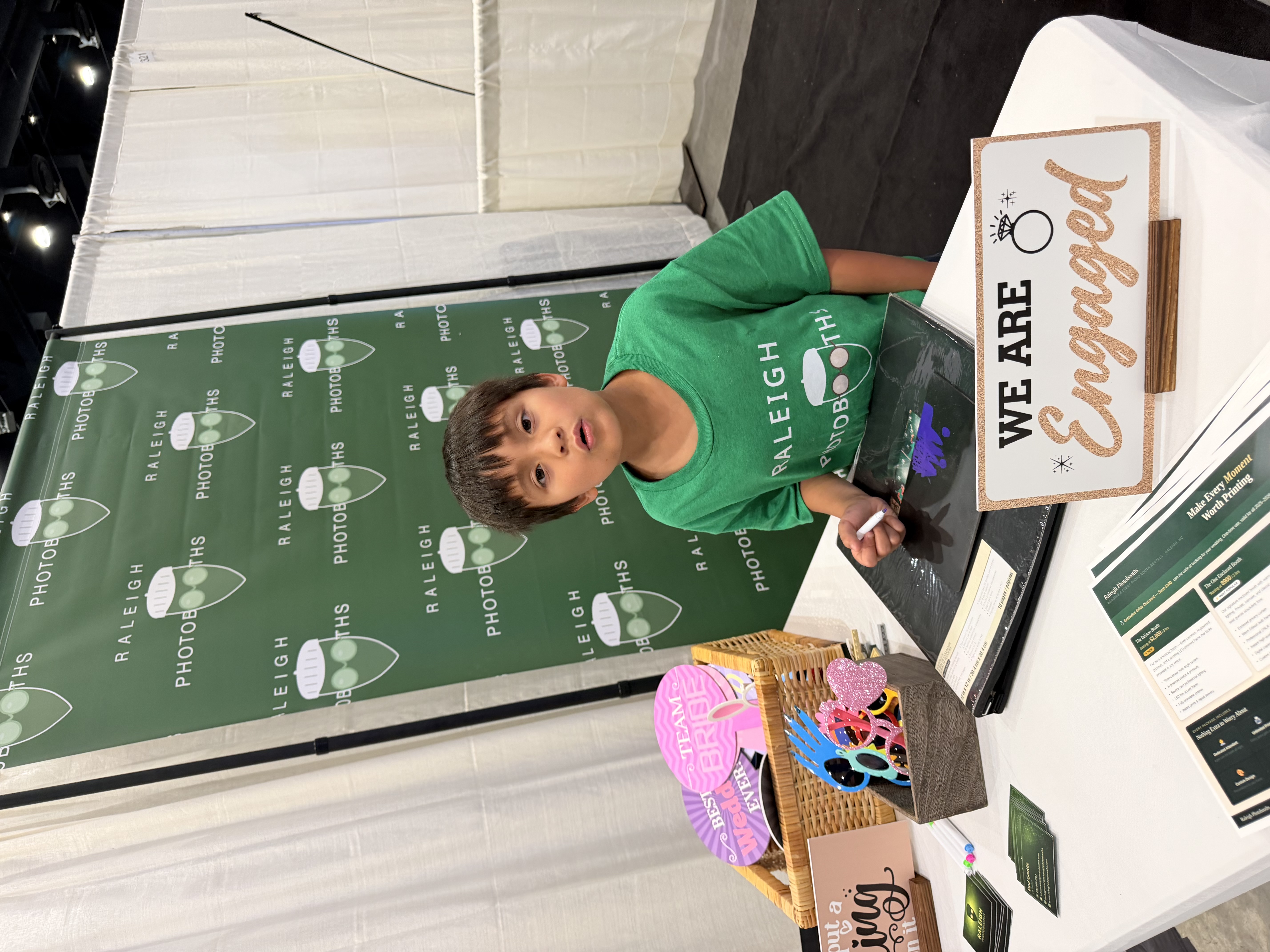 Our son helping at the Raleigh Photobooths booth at the NC Bridal Expo