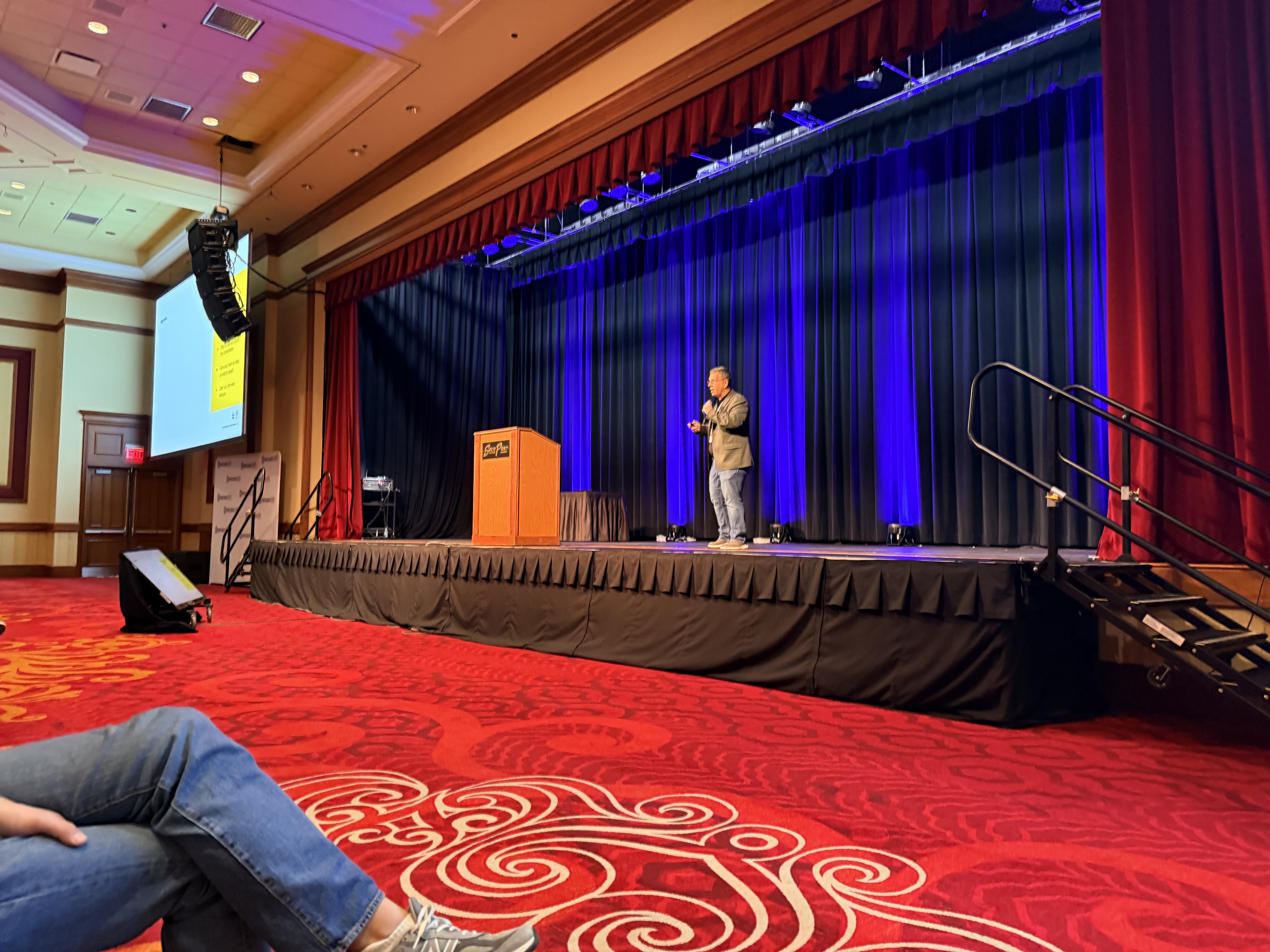 Tom Chelednik presenting on stage at Photo Booth Expo