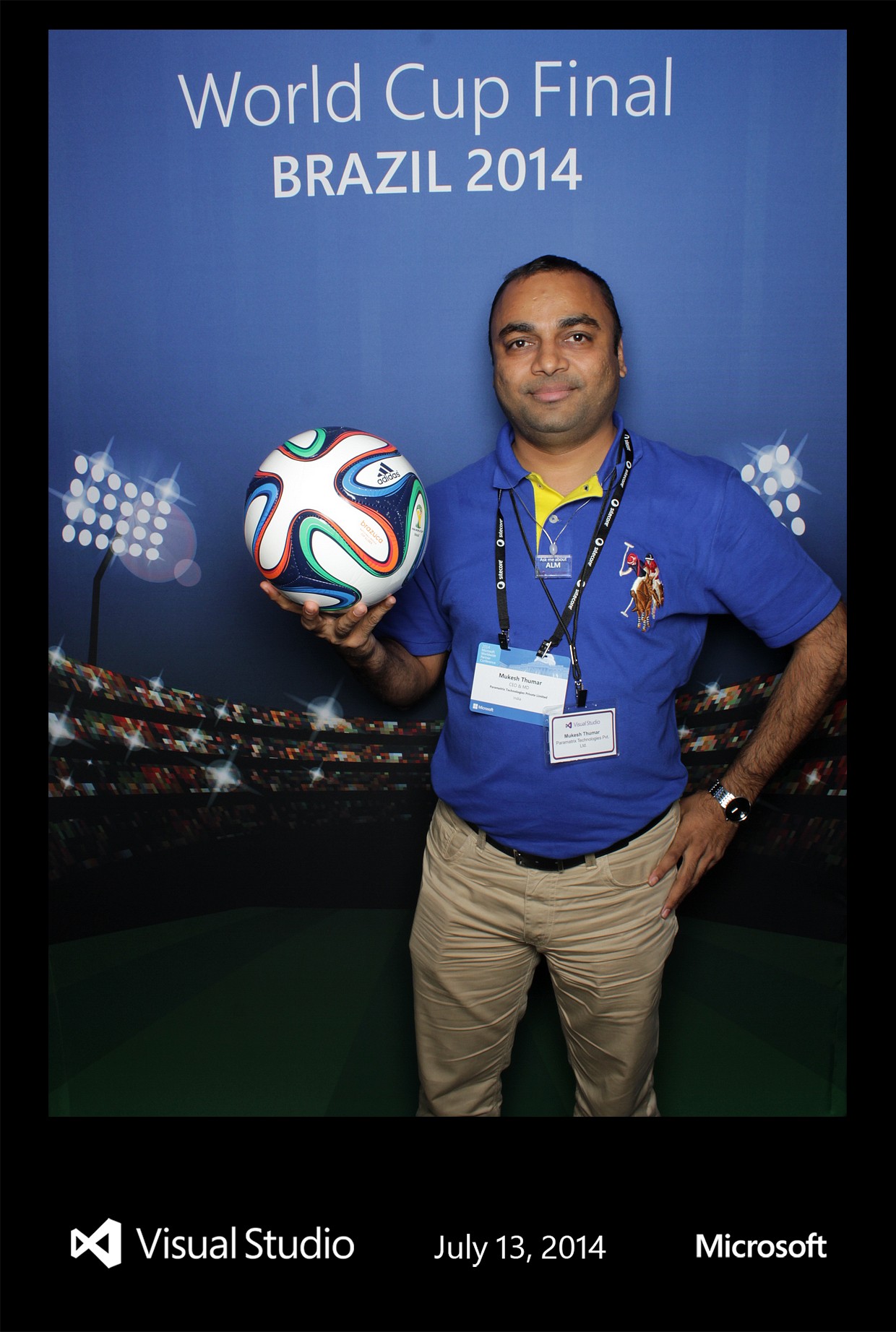 Guest posing with a World Cup soccer ball at the Raleigh Photobooths booth